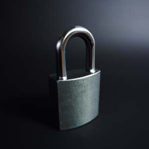 A grey padlock on a black background.