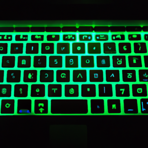 A laptop with a glowing green RGB keyboard.